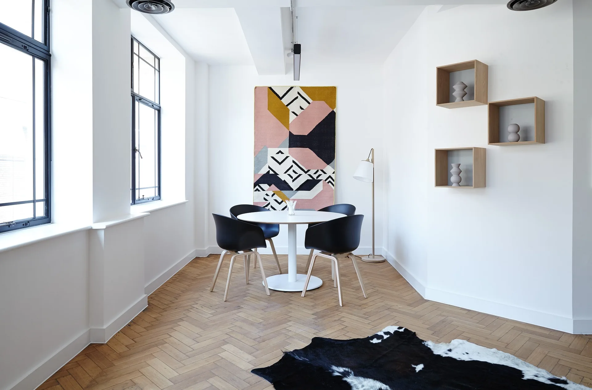 Modern dining nook with designer chairs and natural light